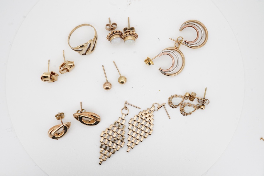 Six assorted pairs of modern 9ct earrings, including white opal and three colour wire, one other pair of unmarked yellow metal earrings and a modern 9ct gold ring. Condition - fair to good